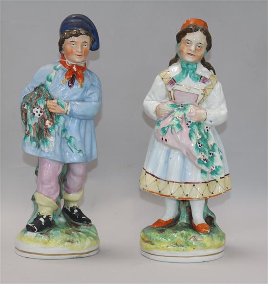 A 19th century Staffordshire holly gatherers, and masons ironstone height 29cm